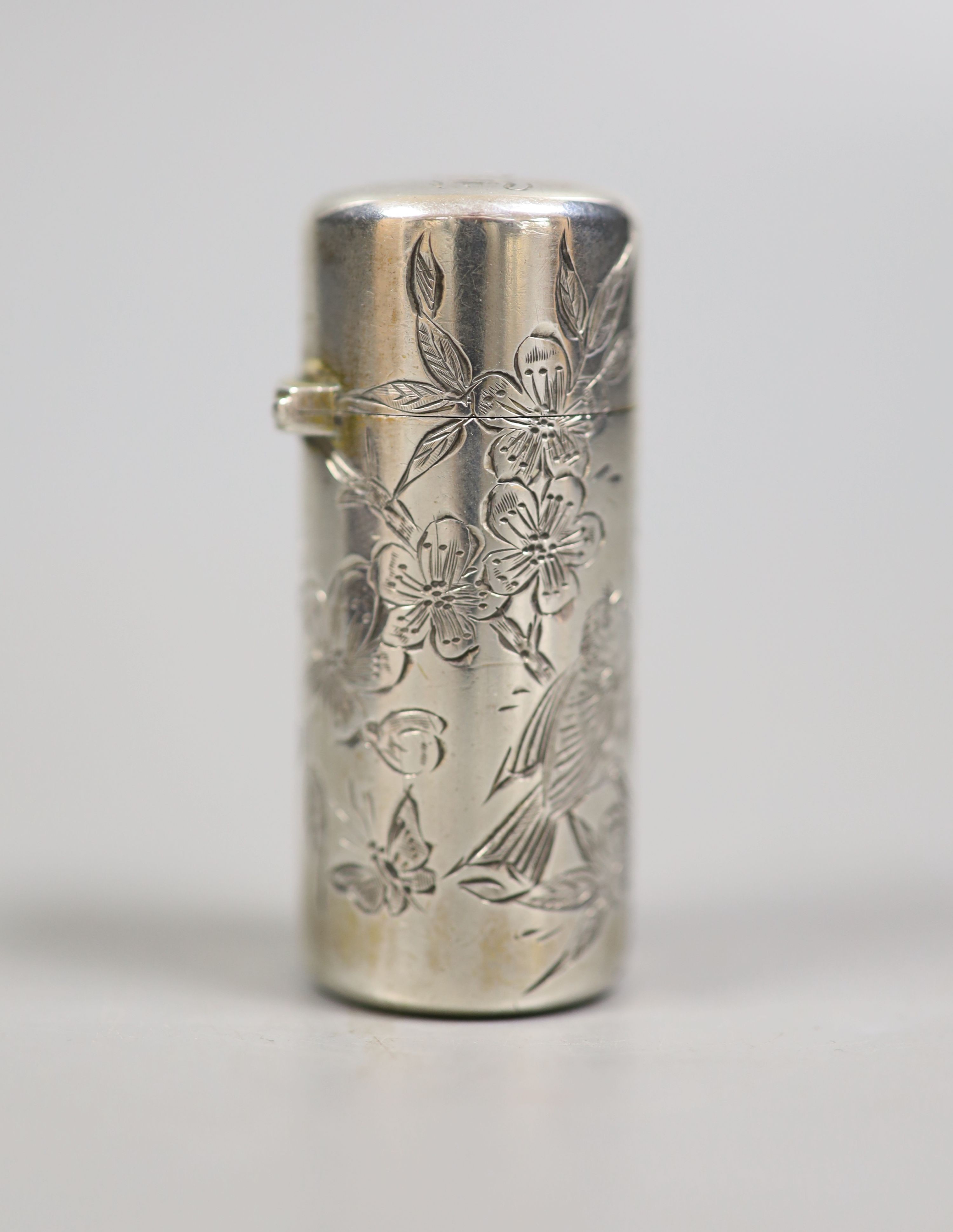 A cased late Victorian silver cylindrical scent bottle, with engraved initials and aesthetic decoration, Sampson Mordan & Co, London, 1882, 53mm.